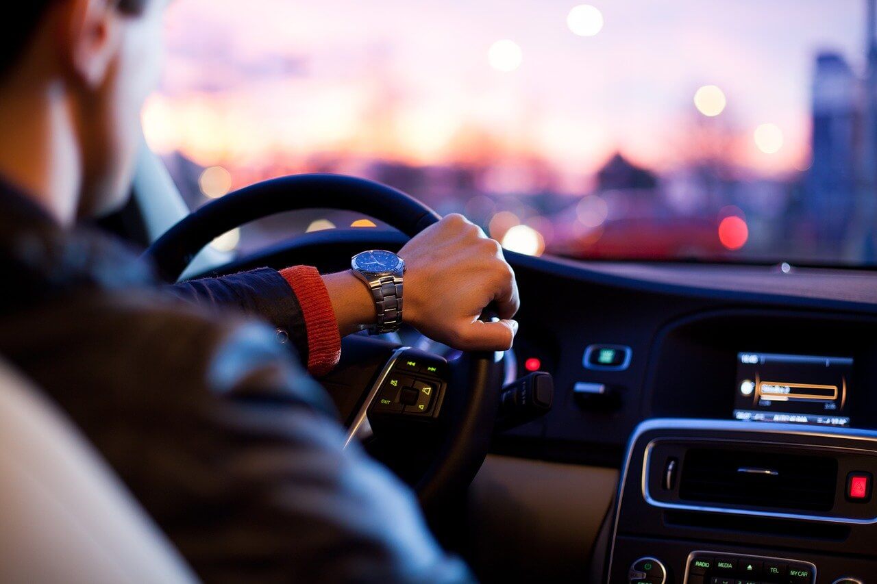 man driving on road man driving on road